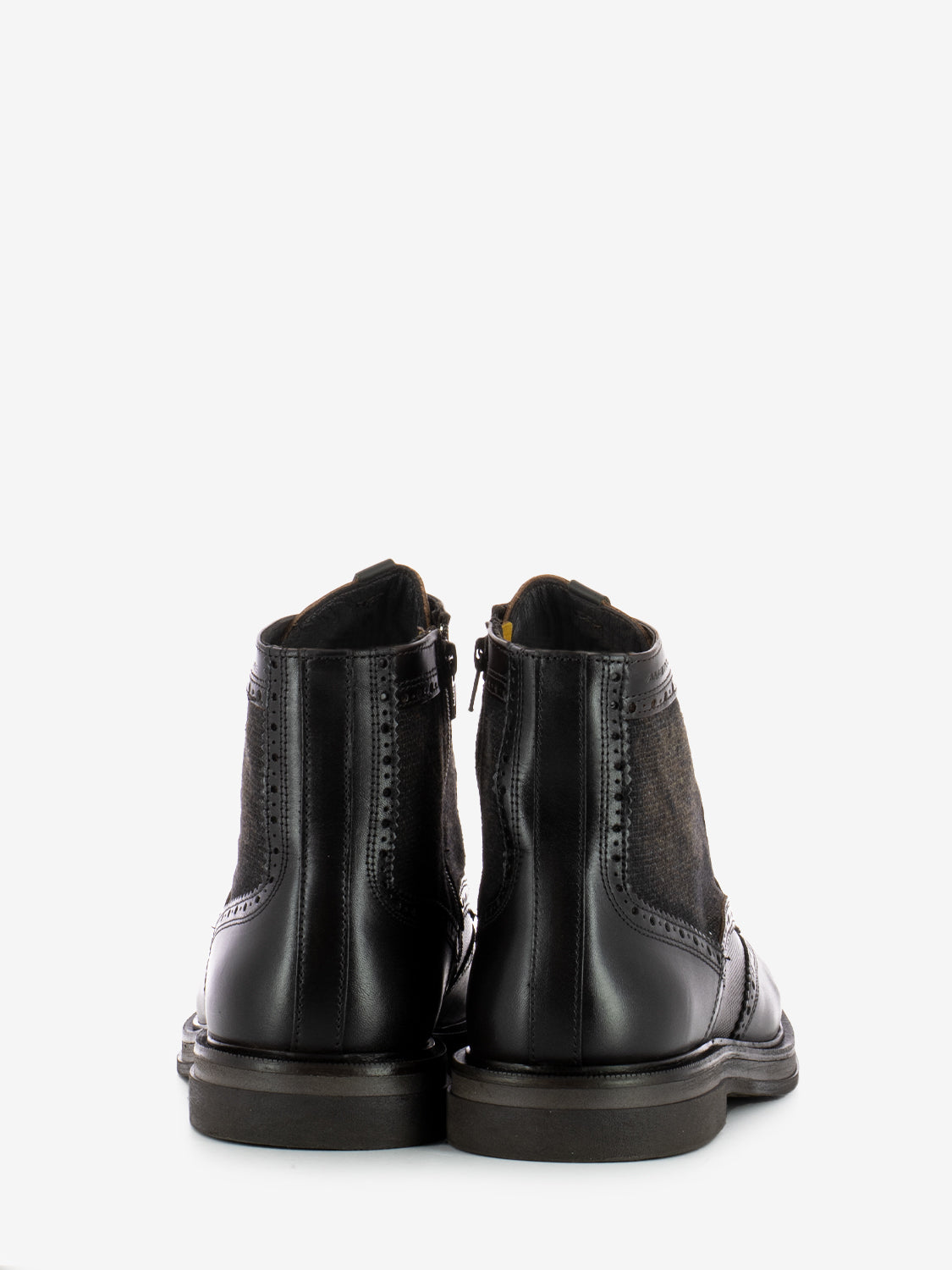 Leather ankle boots with all over brown brogue