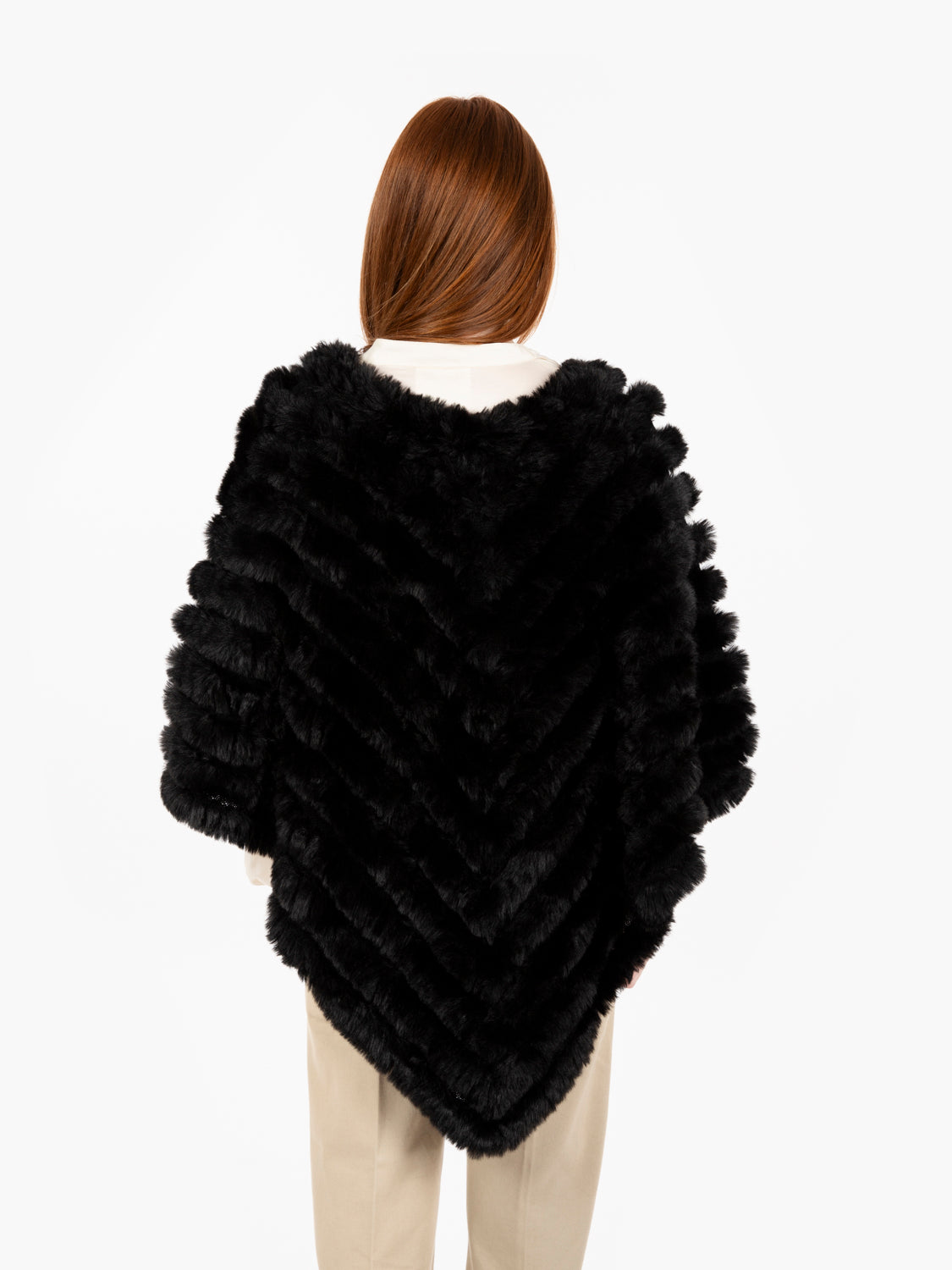 Faux fur poncho with black brooch