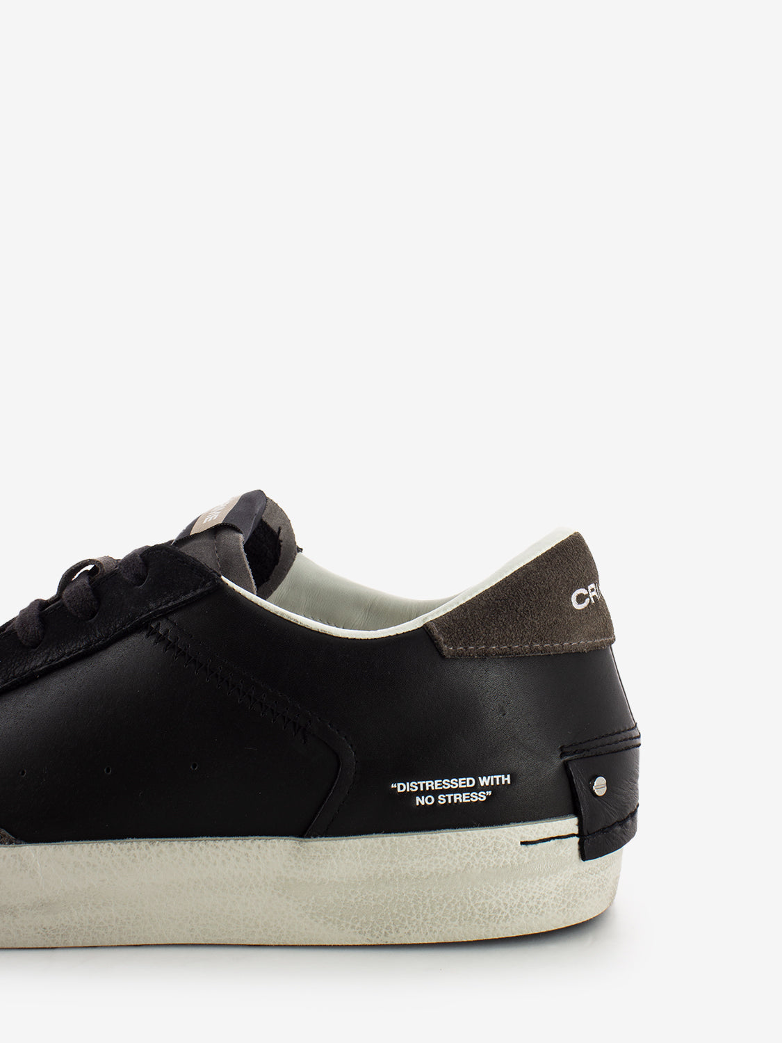 Distressed black sneakers