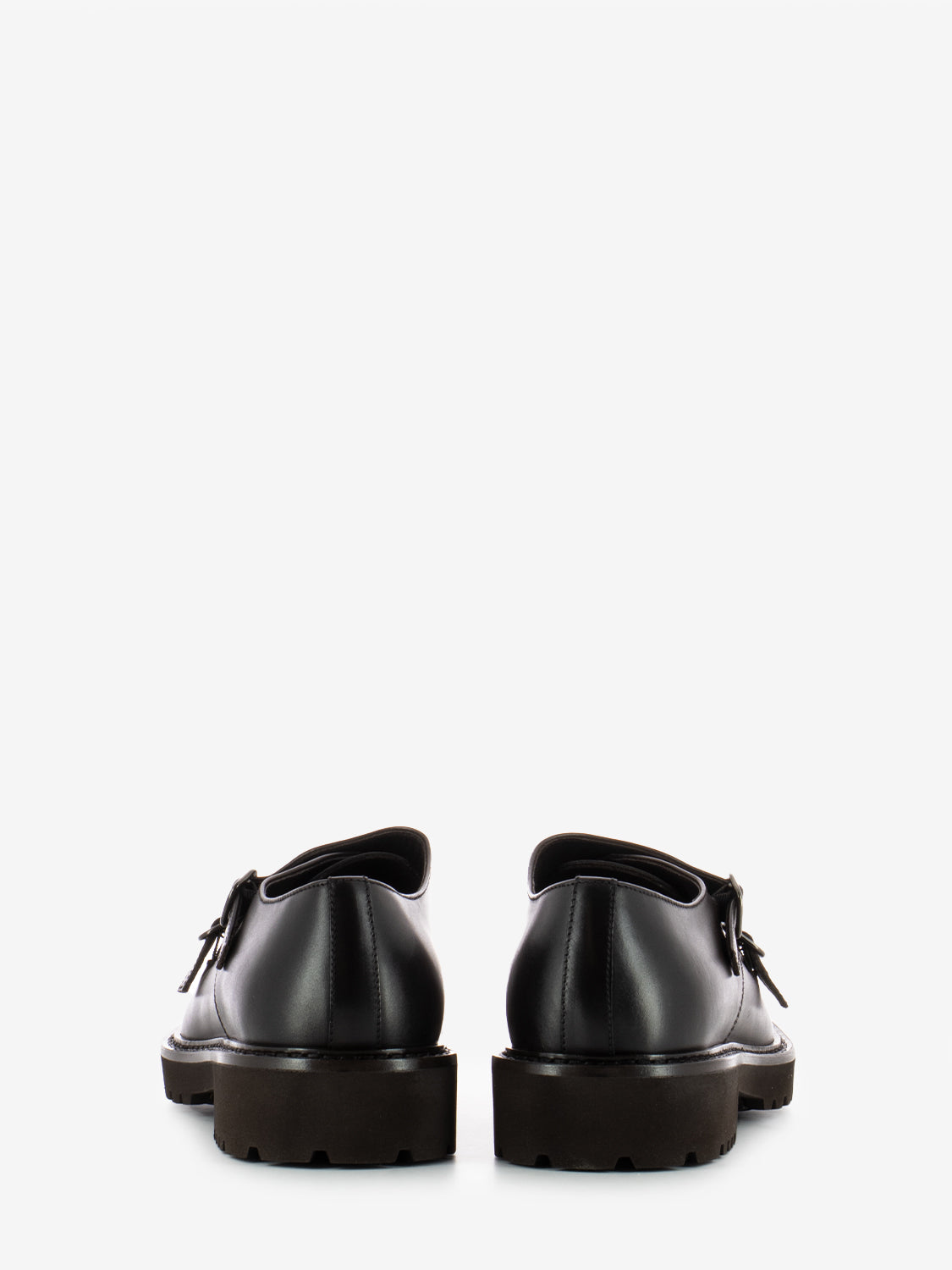Double buckle moccasins with dark brown trim