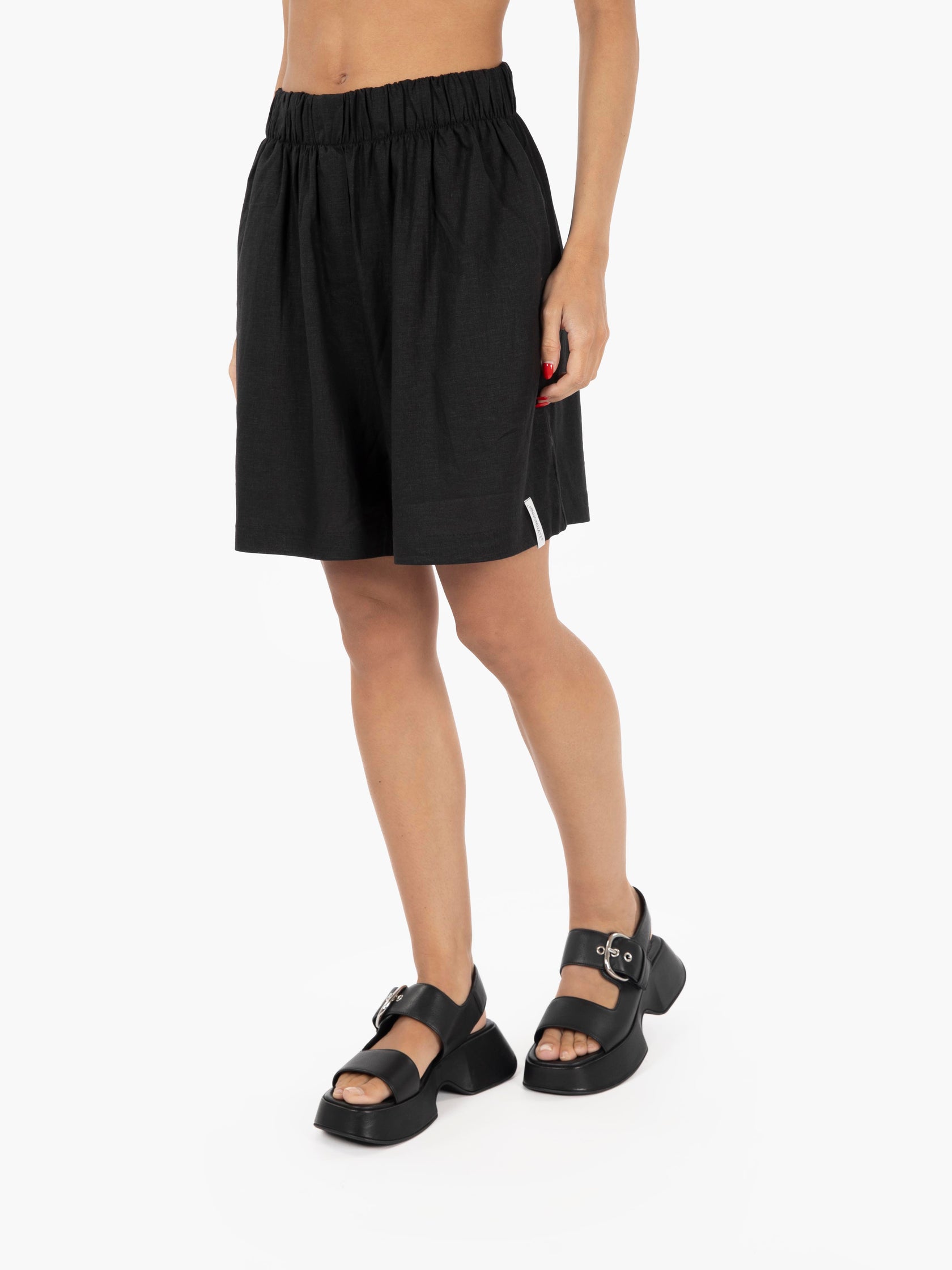 Linen shorts with black elastic waist