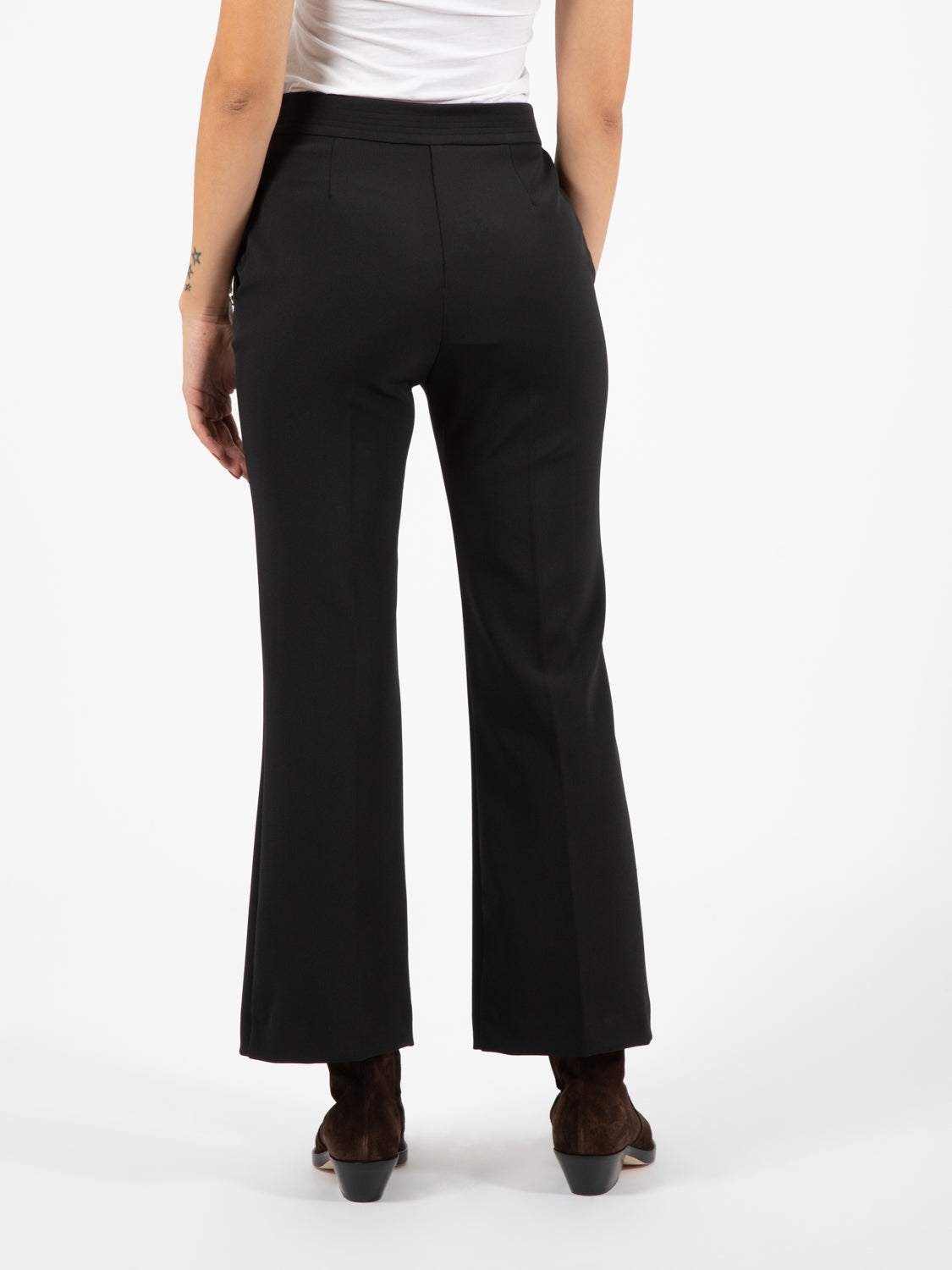 Black buttoned trumpet trousers