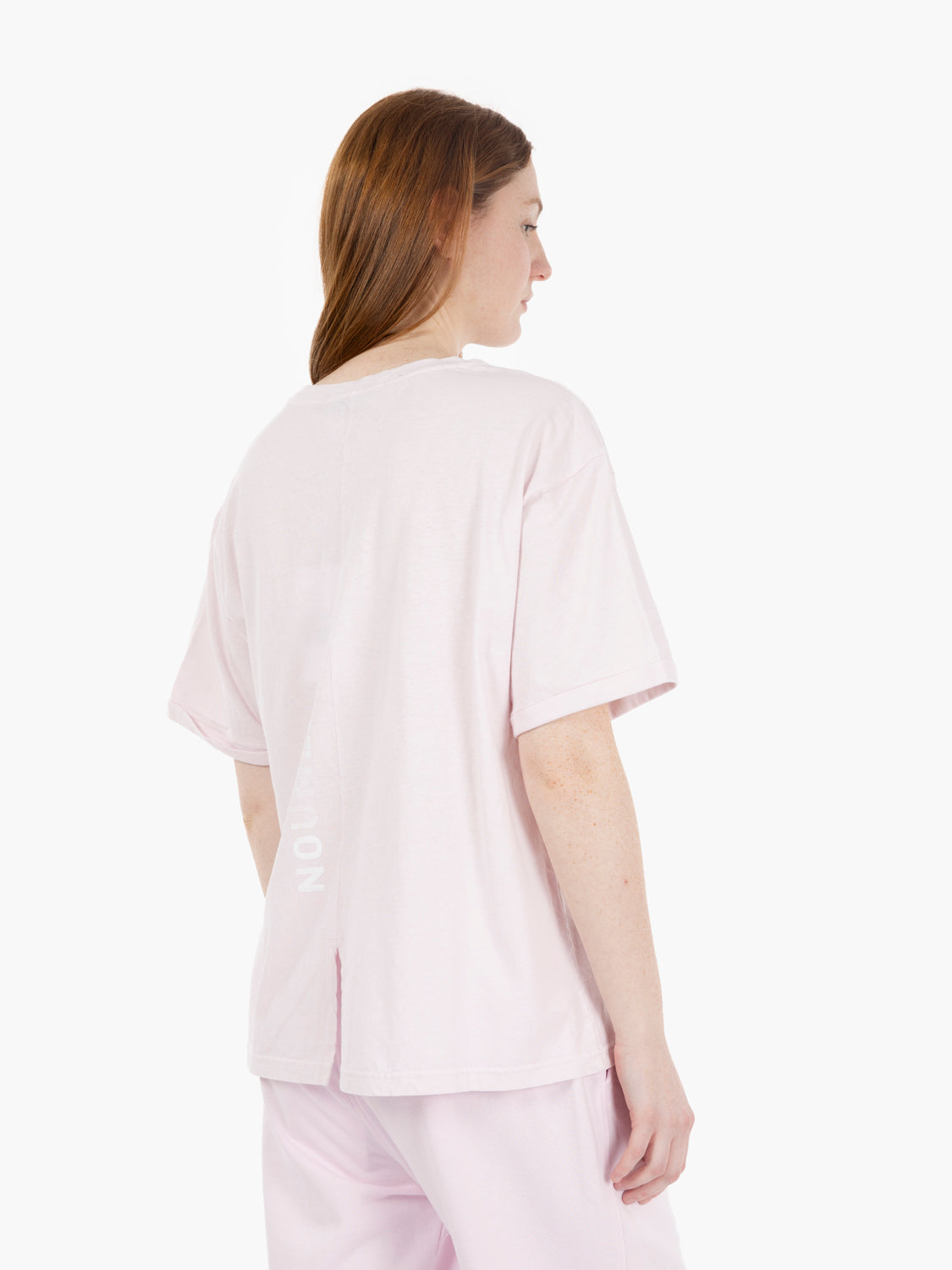 T-shirt girocollo con spacco e grafica sul retro rosa