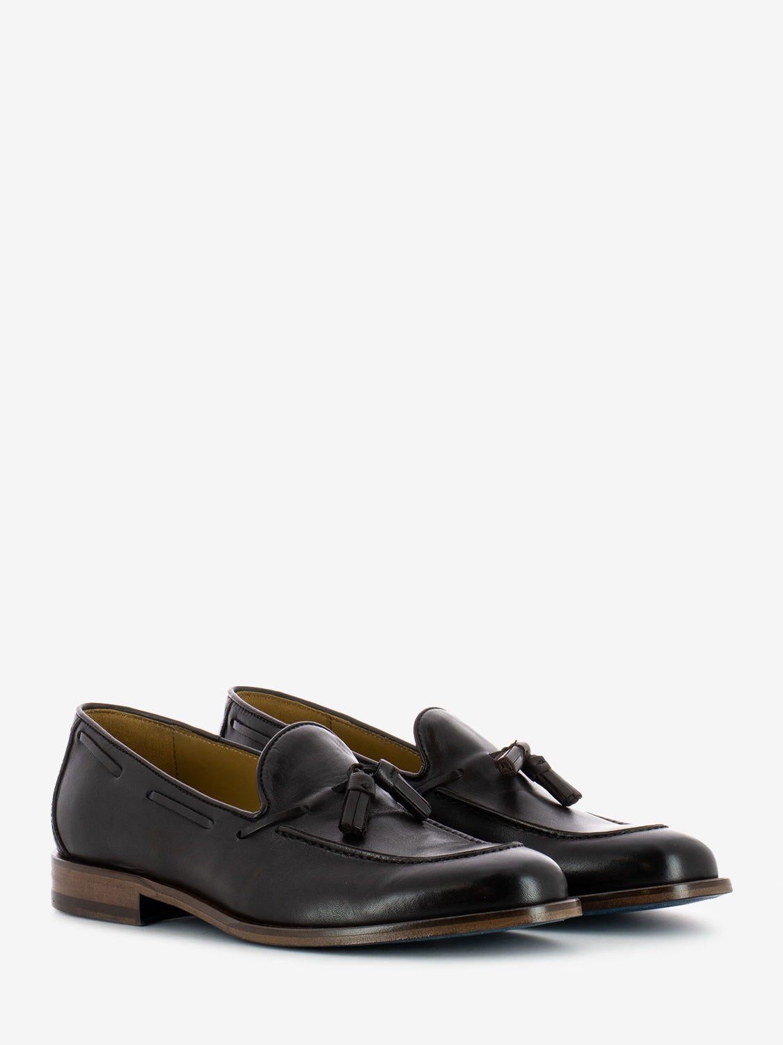 Leather moccasins with dark brown tassel