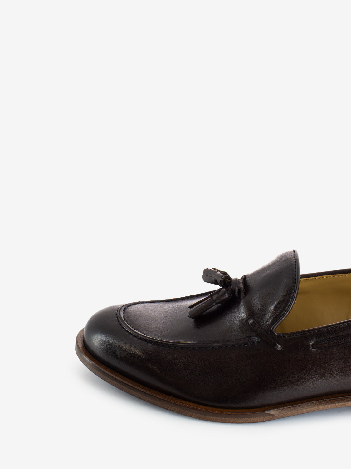 Leather moccasins with dark brown tassel