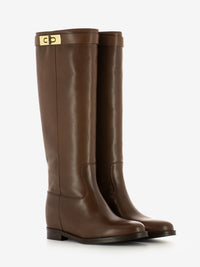 Stivali con fibbia e zeppa interna cuoio