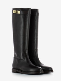 Stivali in pelle con zeppa interna testa di moro