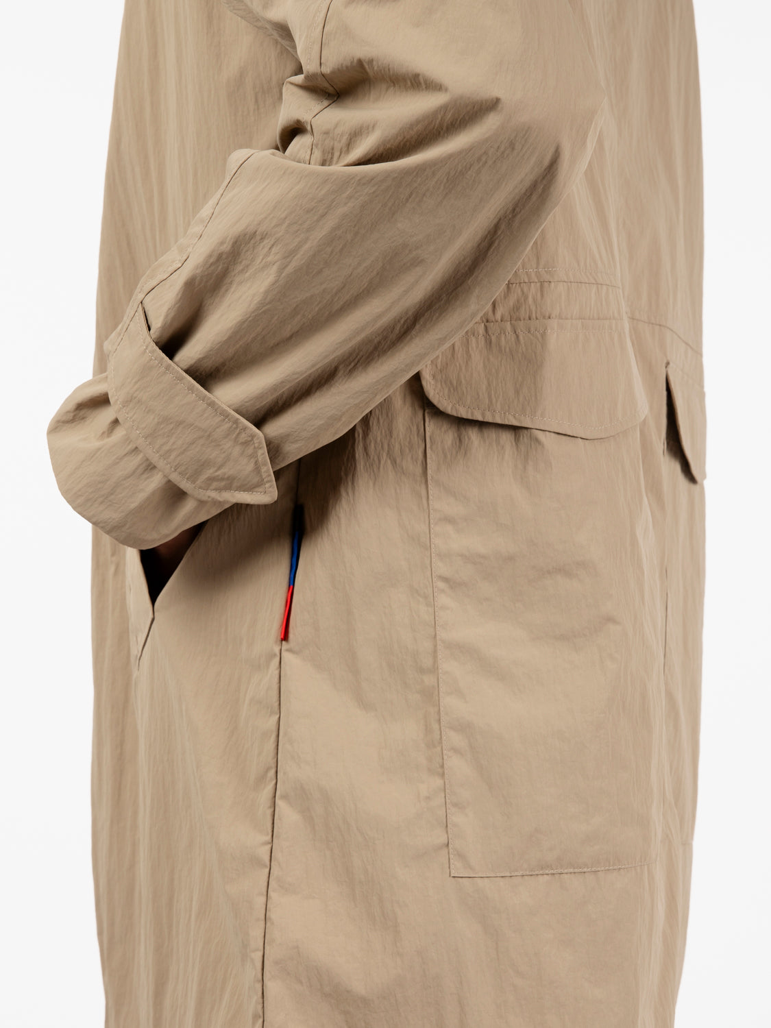 Beige multi-pocket trench coat