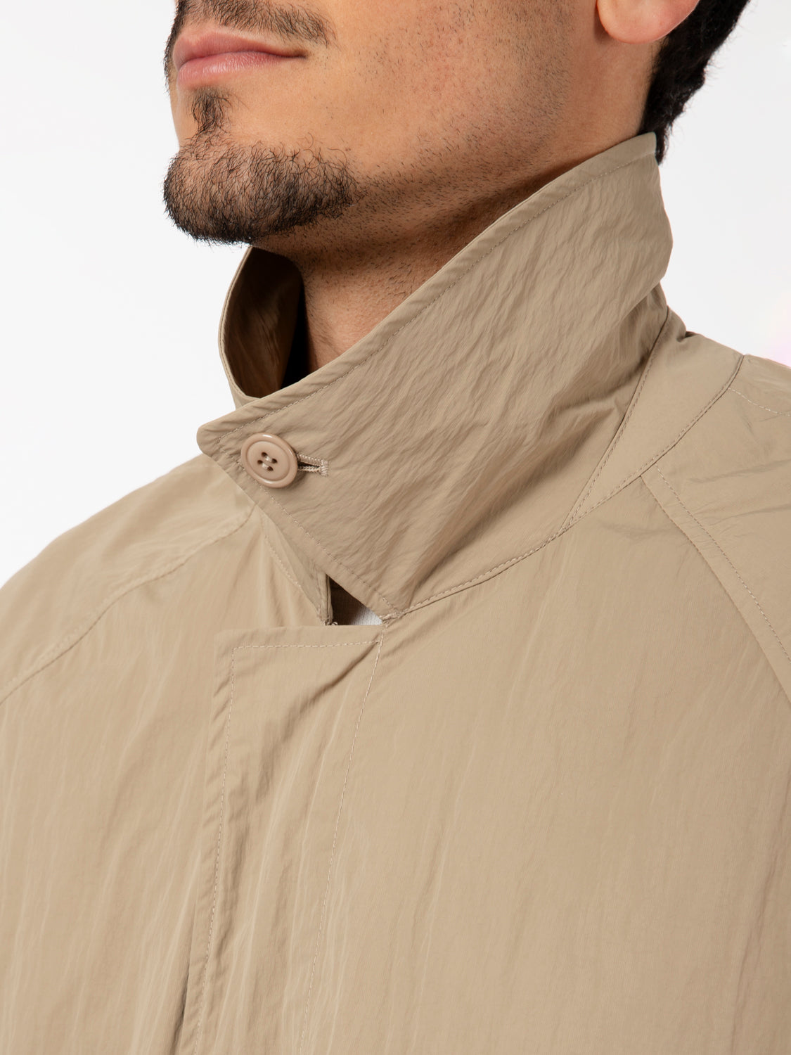 Beige multi-pocket trench coat