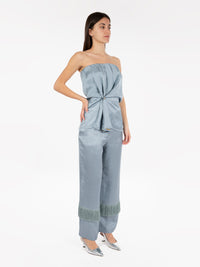 Trousers in malfilè satin with dusty fringes