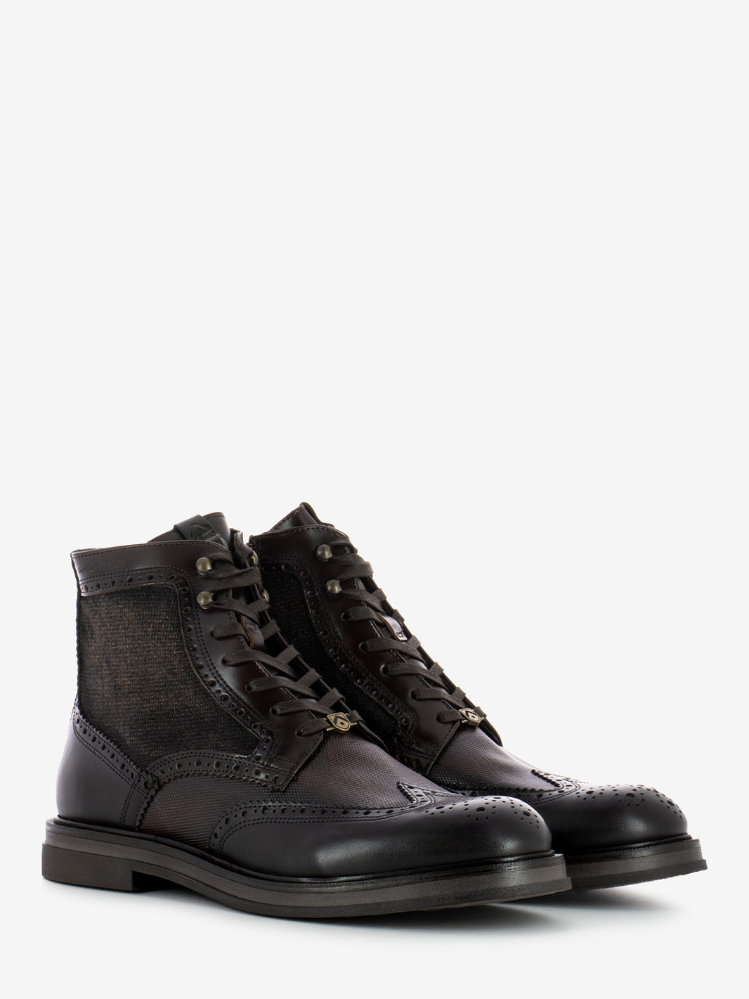 Leather ankle boots with all over brown brogue