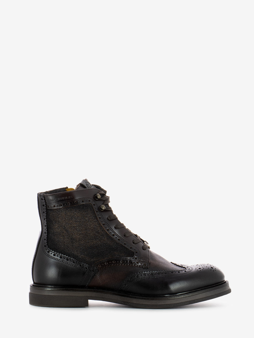 Leather ankle boots with all over brown brogue