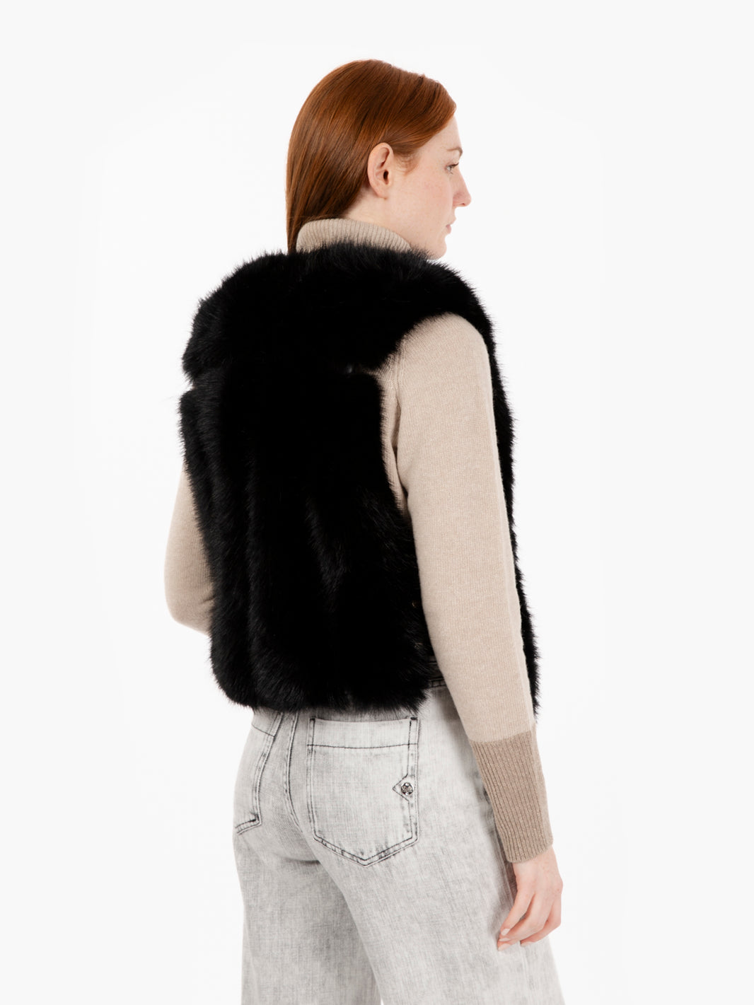 Faux fur vest with black straps