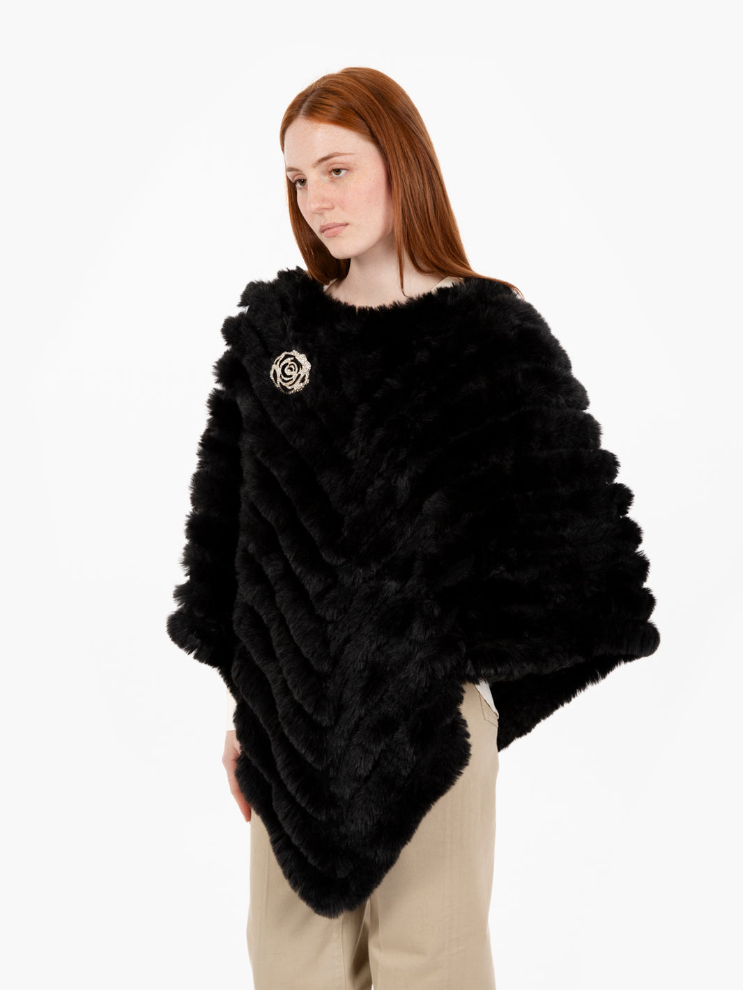 Faux fur poncho with black brooch