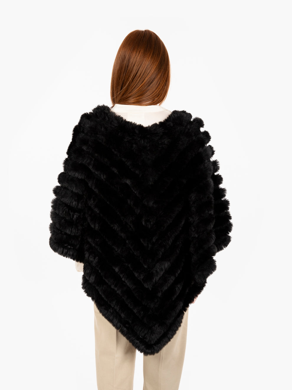 Faux fur poncho with black brooch