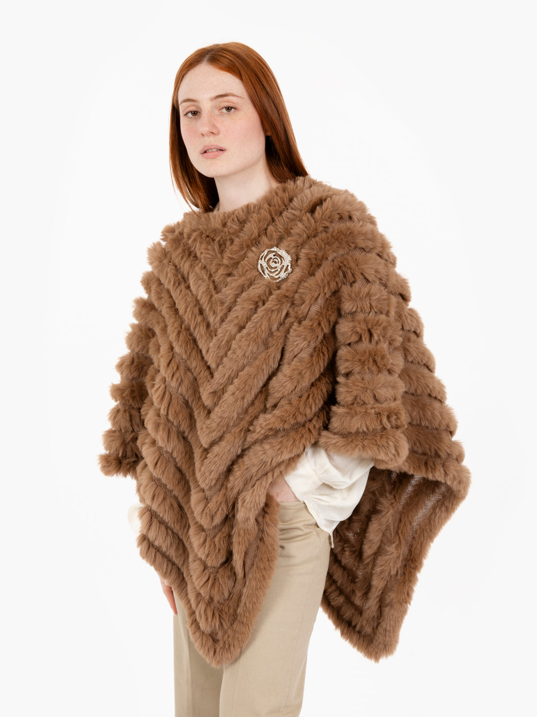 Faux fur poncho with toasted coconut brooch