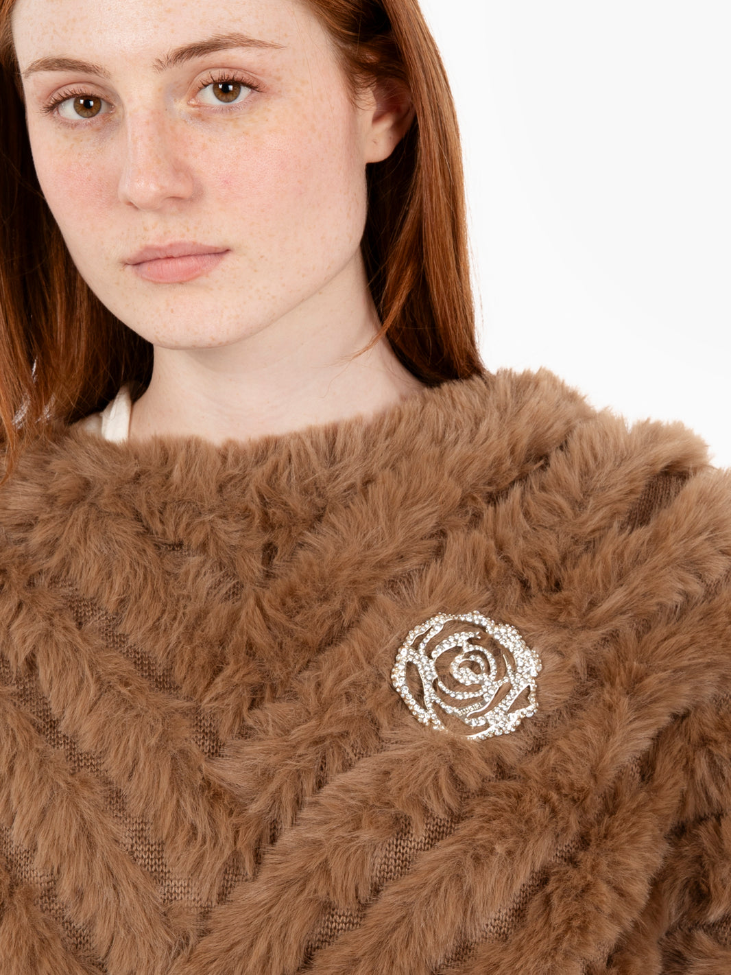 Faux fur poncho with toasted coconut brooch