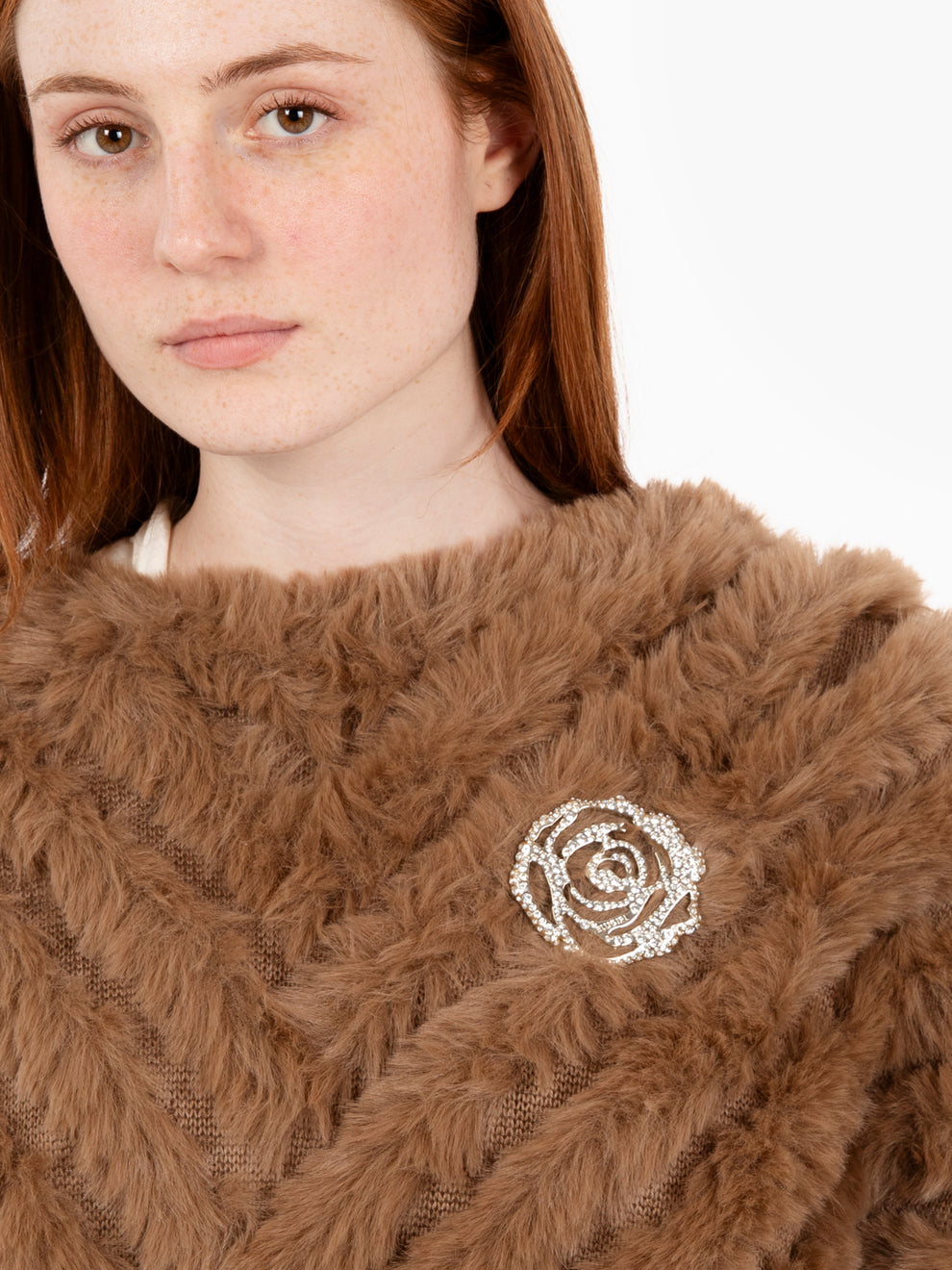 Faux fur poncho with toasted coconut brooch