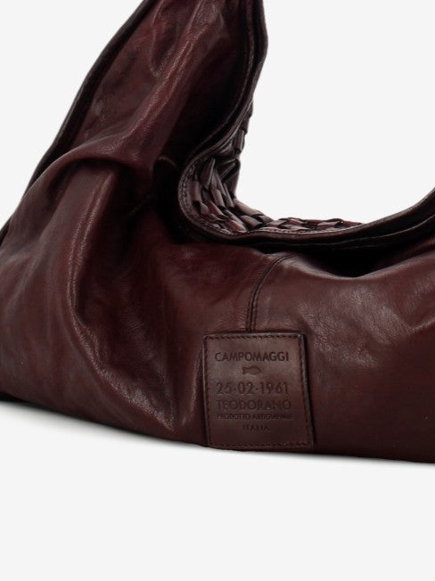 Atena braided leather bag in maroon