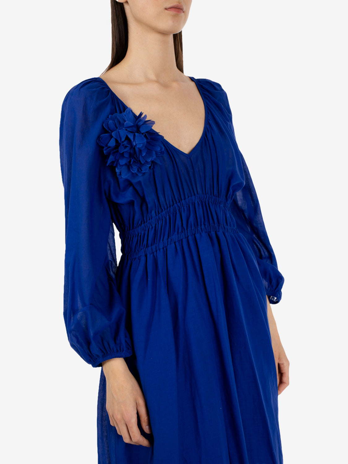 Long dress with electric blue brooch