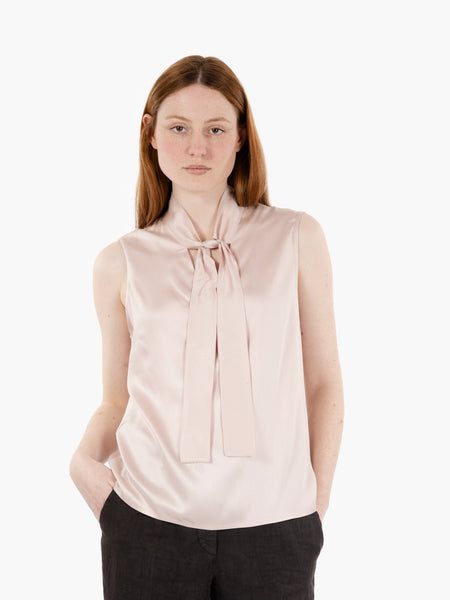 Blusa con fiocco rosa