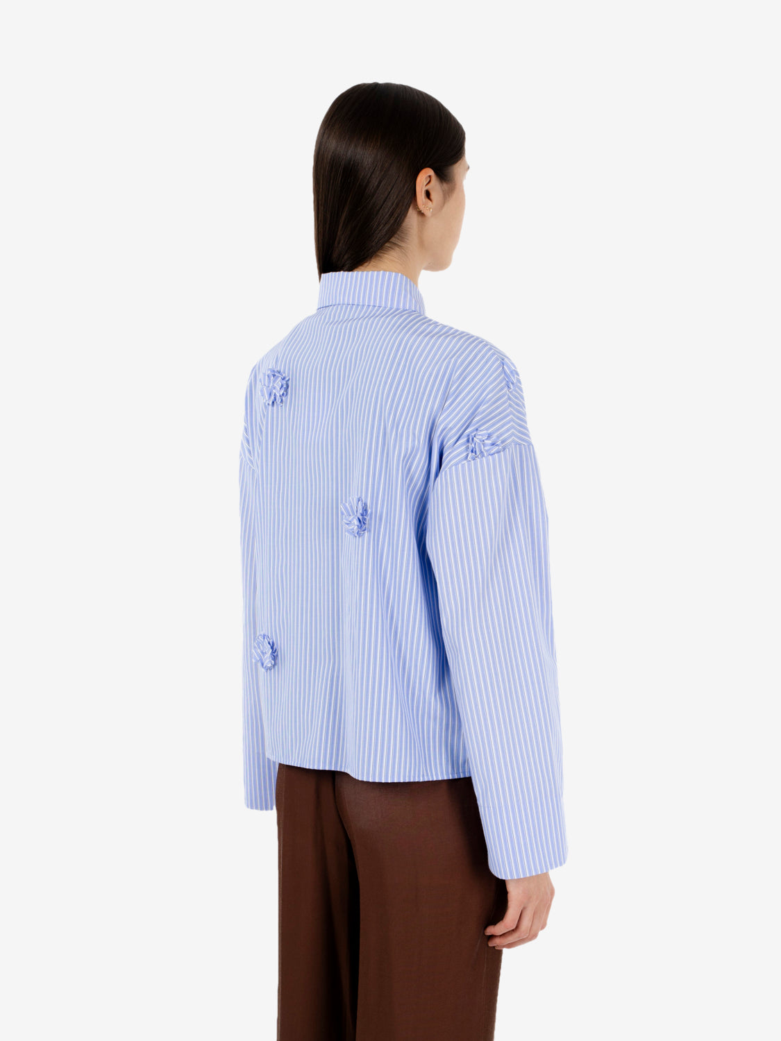 Striped shirt with applied blue flowers