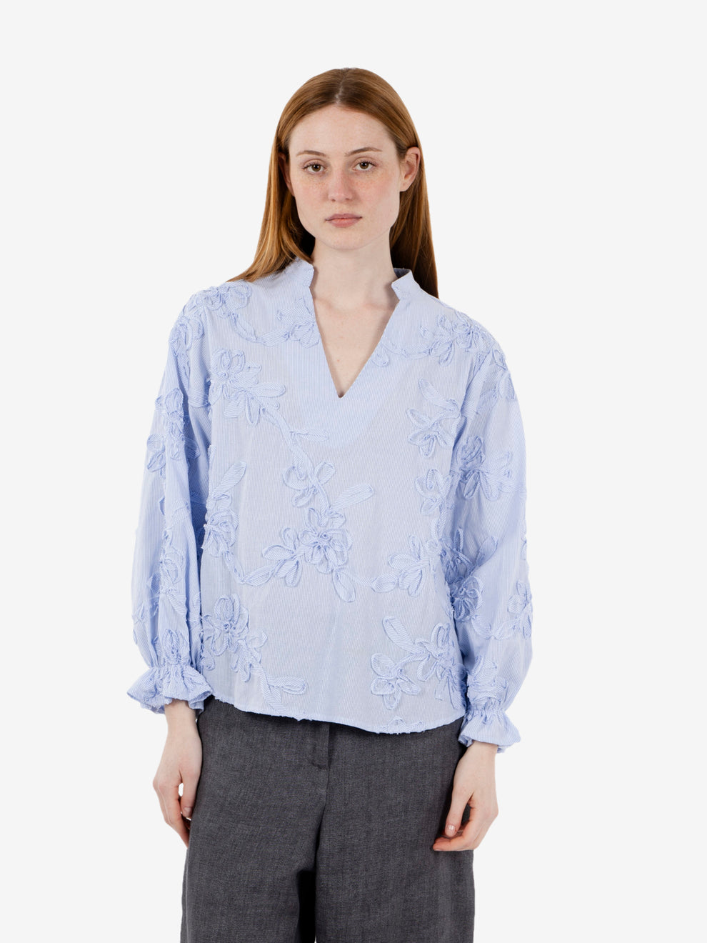 Patterned light blue striped shirt