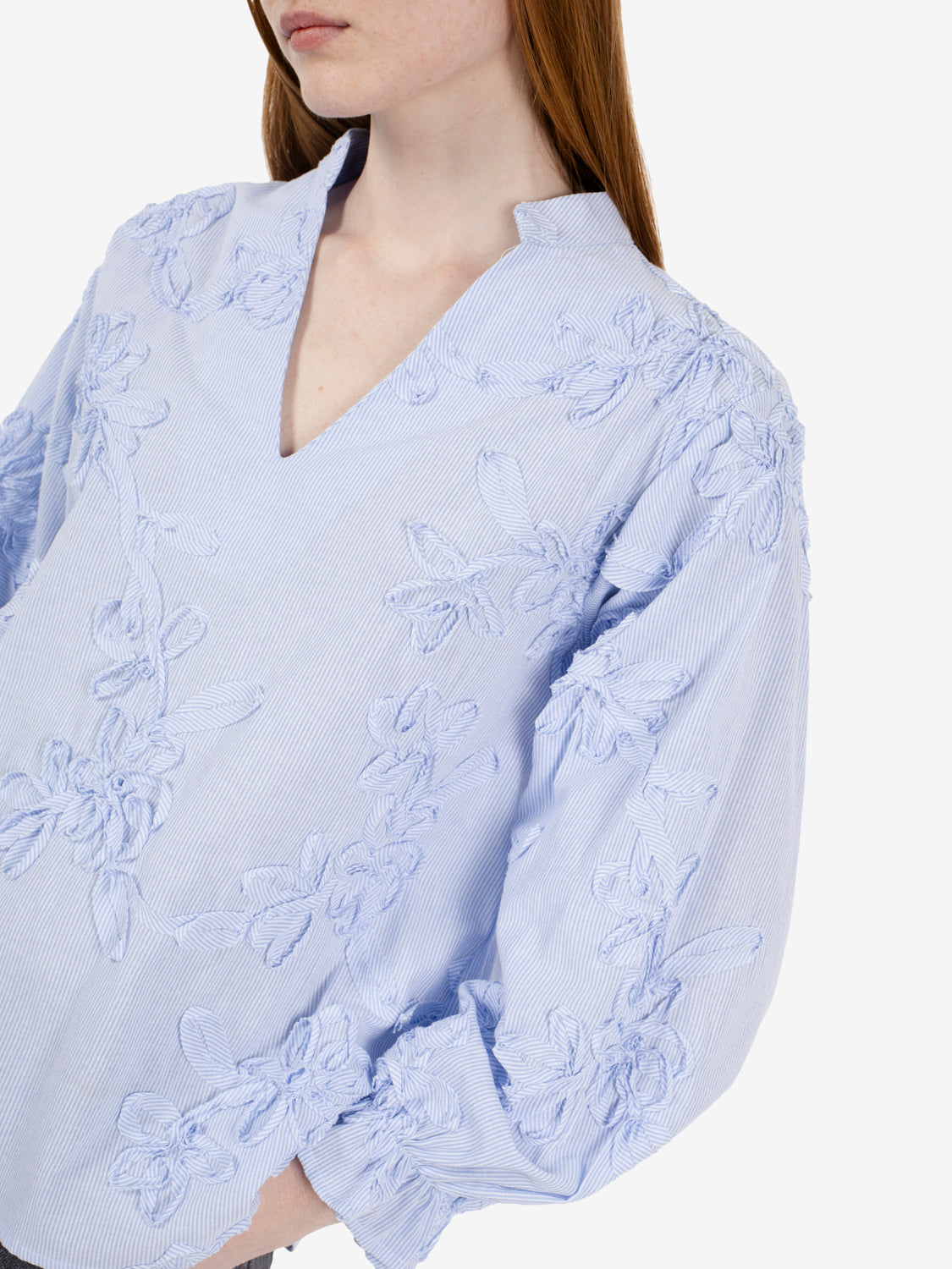 Patterned light blue striped shirt