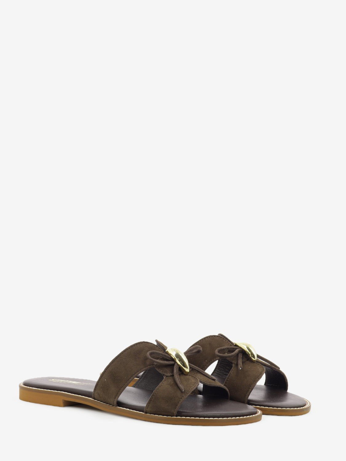 Suede slipper with Moor's head embellishment