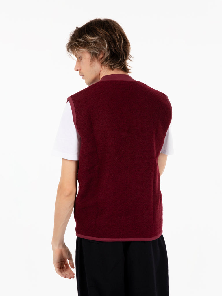 UNIVERSAL WORKS - Zip waistcoat in lovat wool fleece deep red