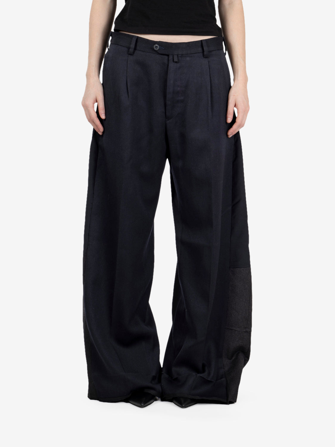 Black pleated trousers