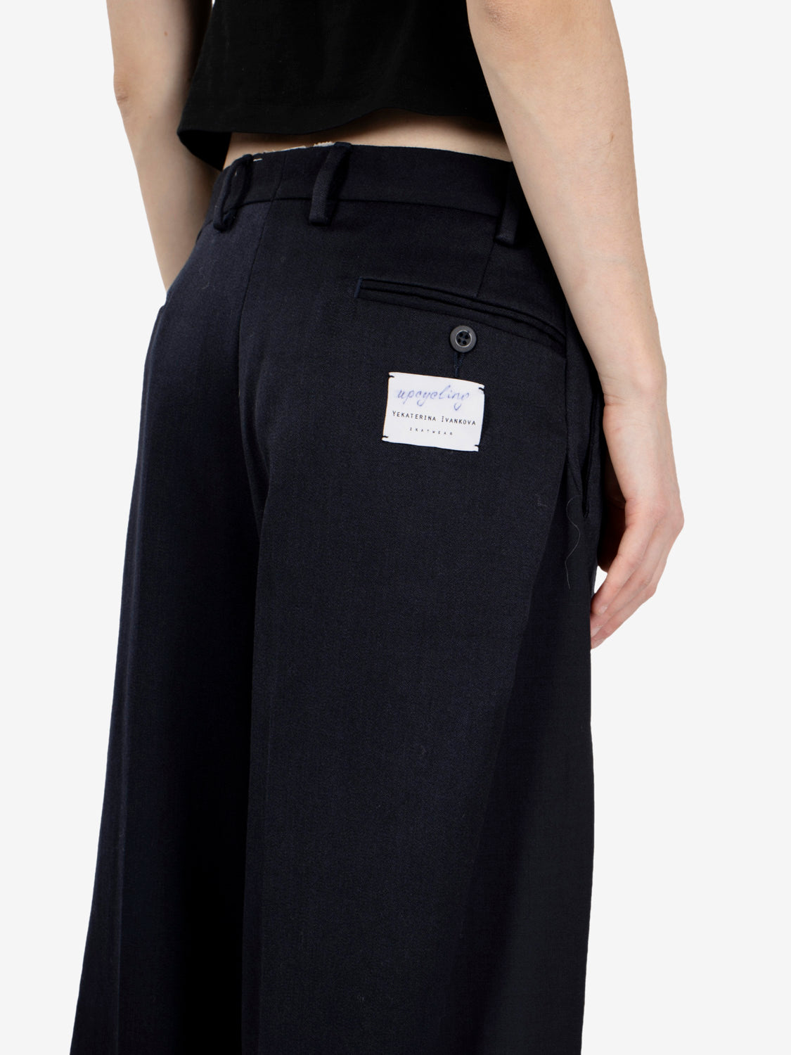 Black pleated trousers