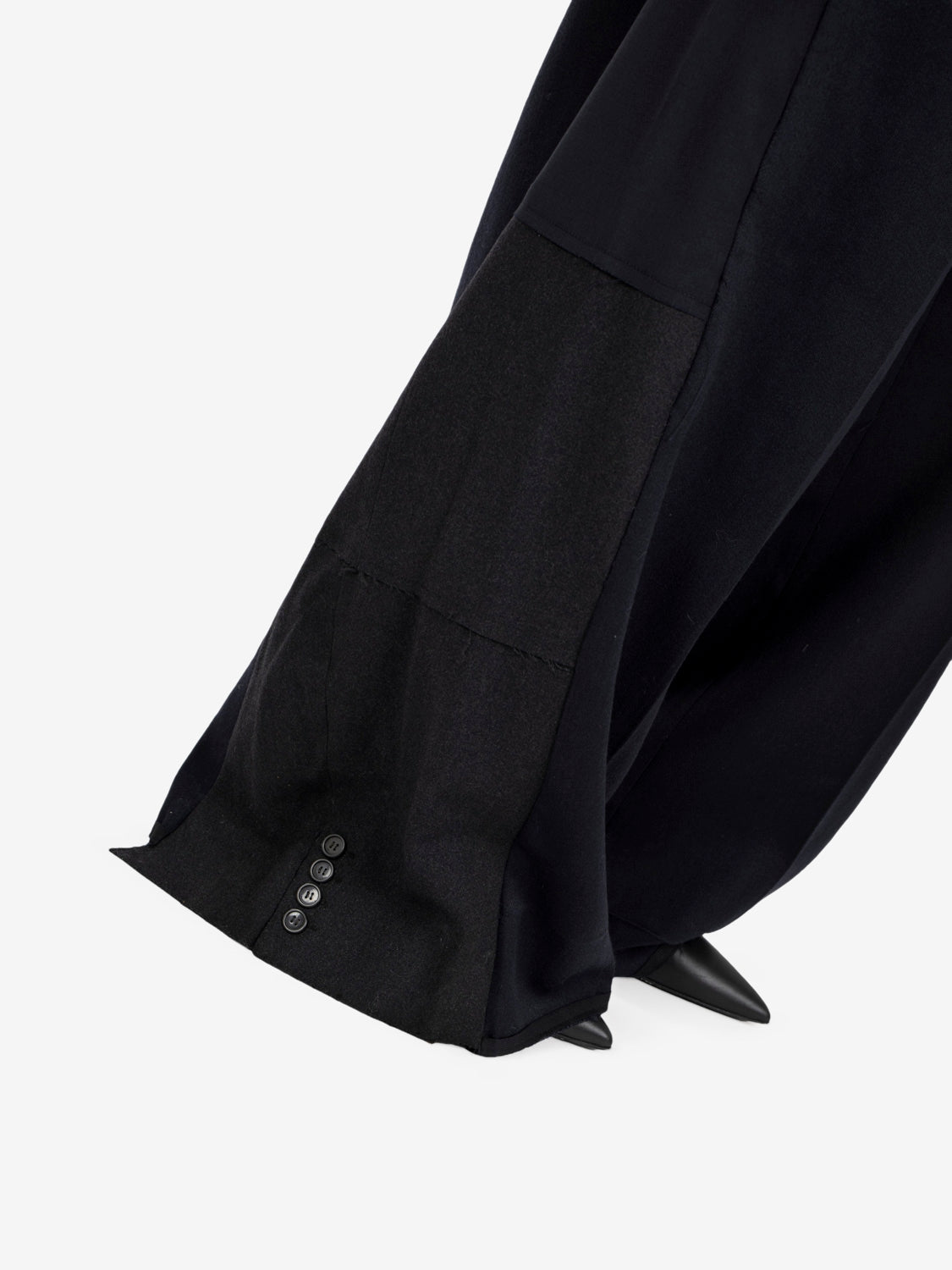 Black pleated trousers