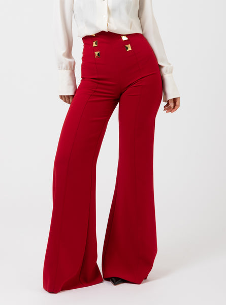 Pantalone a palazzo red velvet con maxi borchie